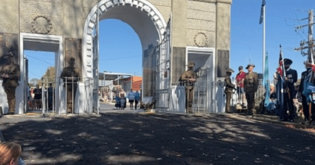A war memorial and a ceremony going on on Anzac Day.