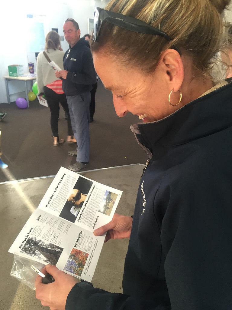 Photograph: A Bermagui resident reads issue one of the Dot…Dot…Dot… magazine.