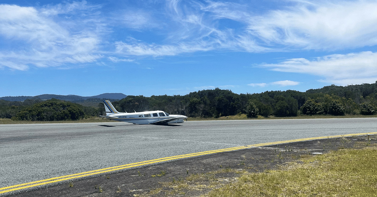 The light aircraft on the runway at Merimbula Airport.