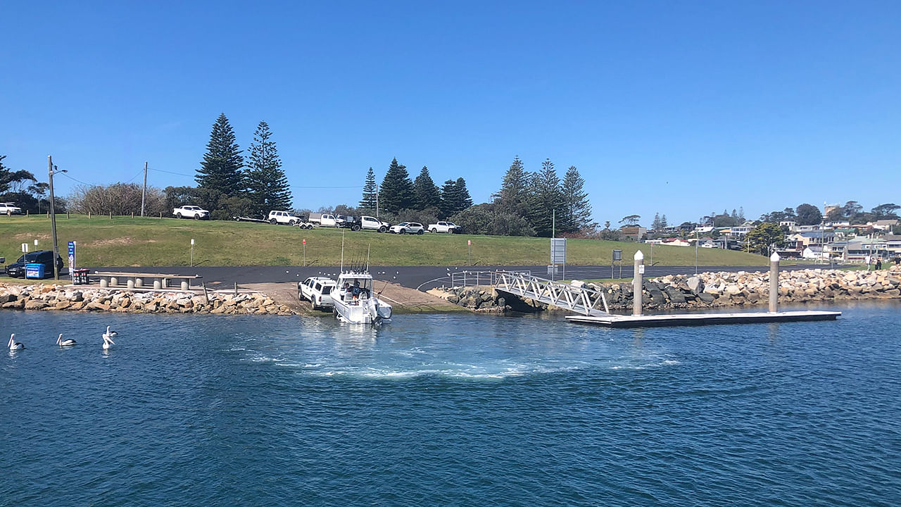 Boat being launched at Bermagui harbour boat ramp.