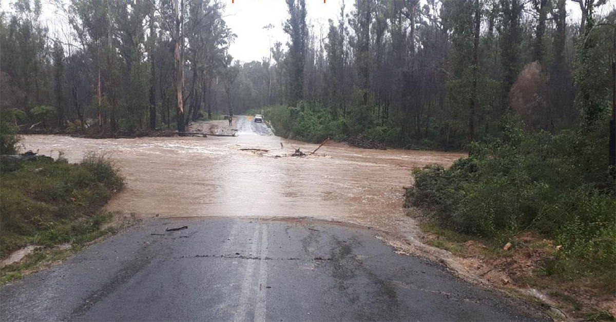 Road with flood water over it.