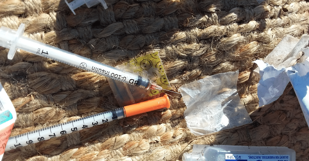 Used needles and syringes found during routine waste handling.