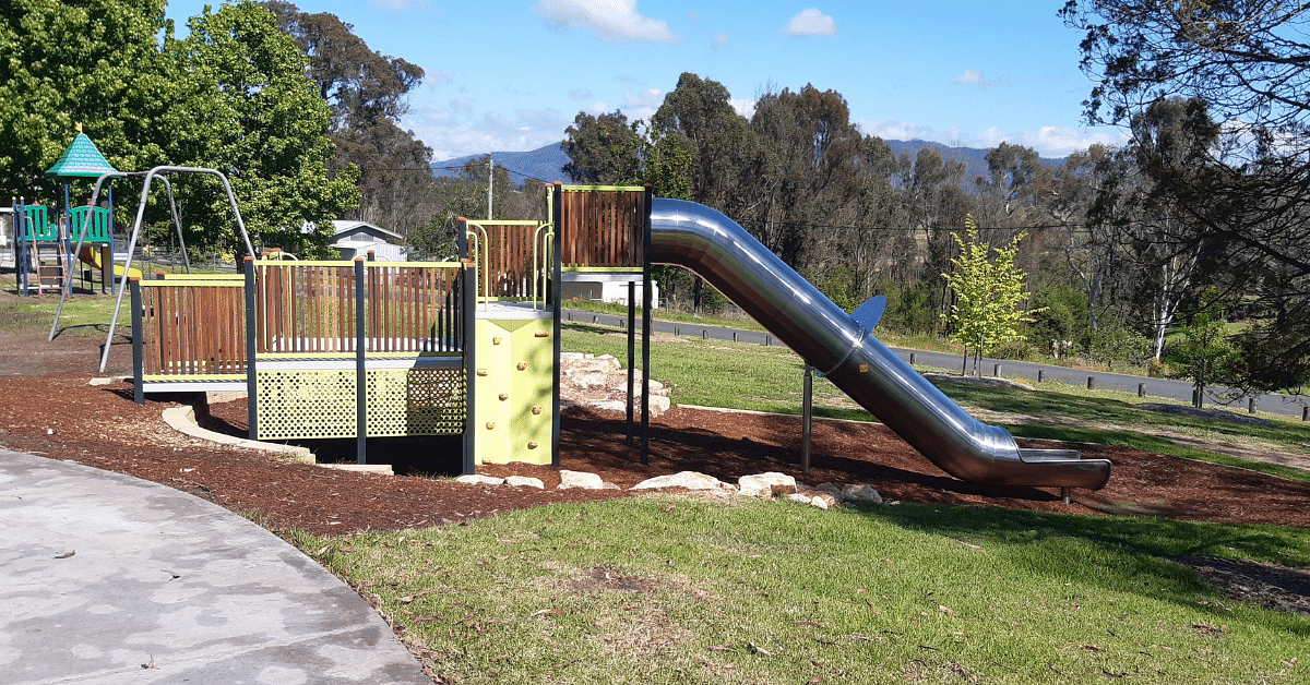 kids playground with a metallic slide.