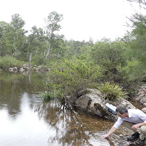 Council's environmental Science Coordinator Ken McLeod, testing water turbidity on the Brogo River.