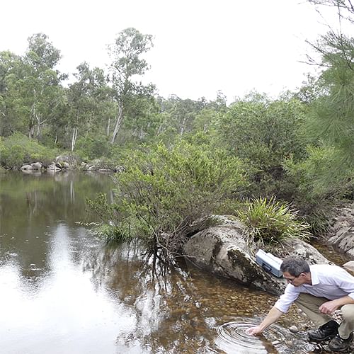 Council's environmental Science Coordinator Ken McLeod, testing water turbidity on the Brogo River.