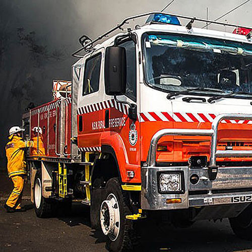 rural fire service fire truck and fireman attending fire