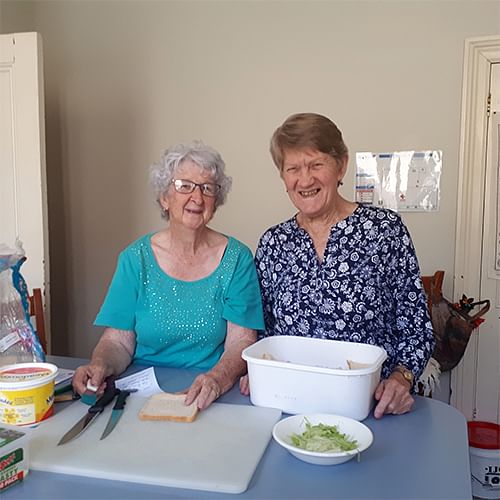 Joan Goldberg and Joyce Smith volunteering at Red Cross in Bega.