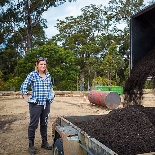 Mayor Cr Kristy McBain picks up a load of compost from the Merimbula organics processing facility for her garden.