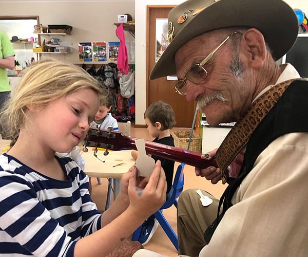 Ross Lowe and Katie enjoy music together at Eden Early Learning Centre. 