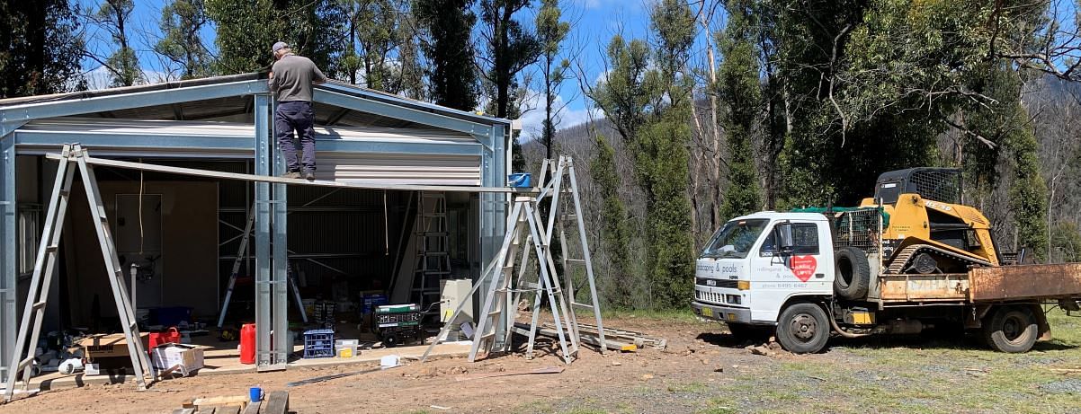Shed with water tank and bathroom being installed on a bushfire impacted property.