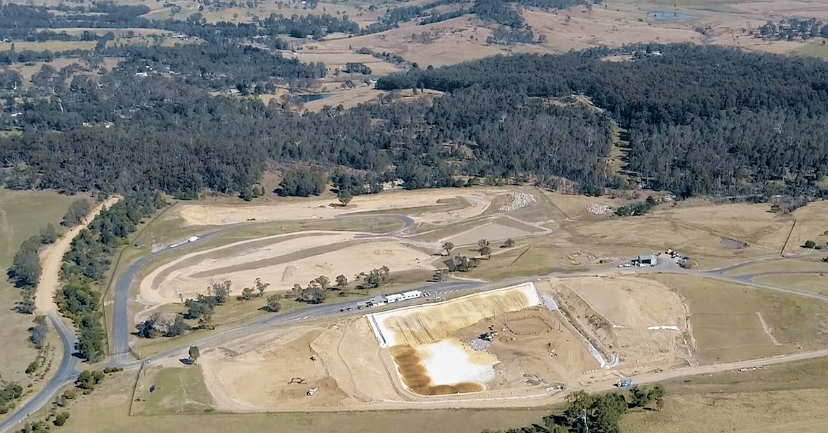 An aerial shot of the CWF site, showing an open landfill cell surrounded by farmland and bush.