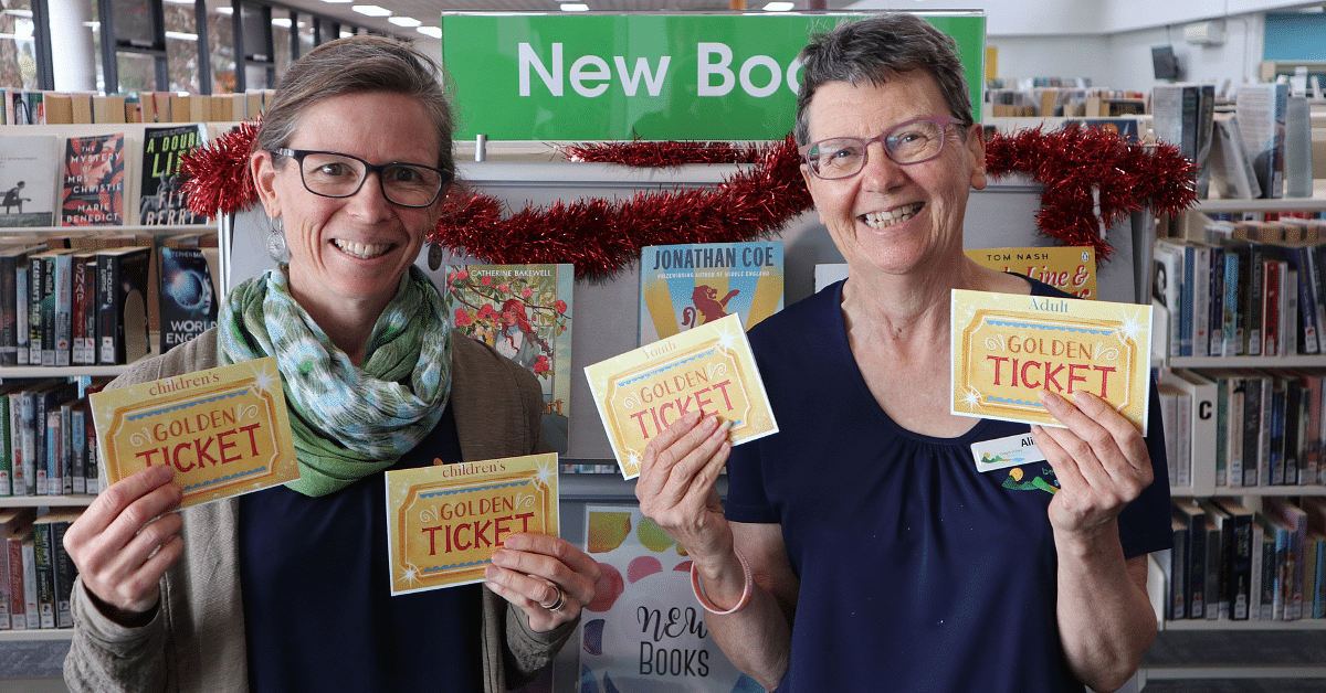 Library staff, Sarah and Alison with Golden Tickets ready for the summer reading campaign.