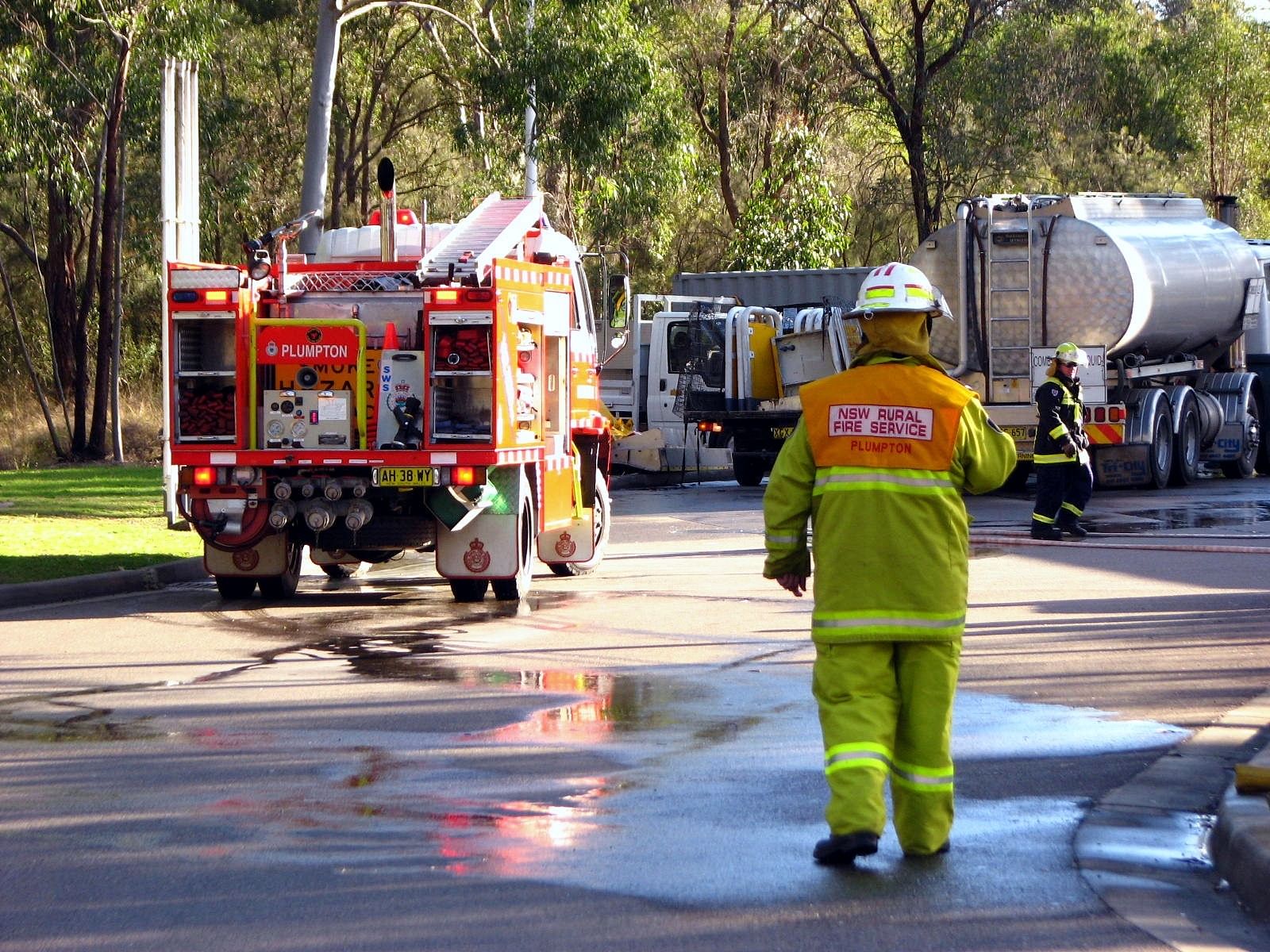 new south whales rural fire service vehicles and workers on site
