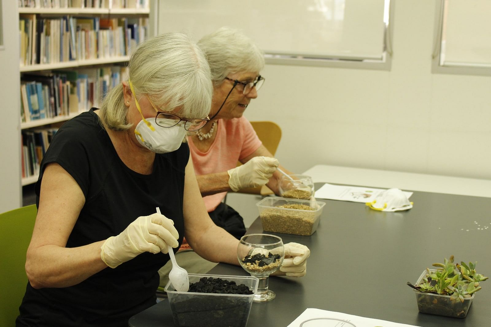 Andrea Olson and Sue Lister enjoy the terrarium-making class at the Bega Valley Shire Library.