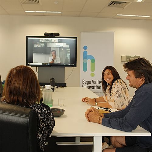 Small business owners participate in a videoconference training session..