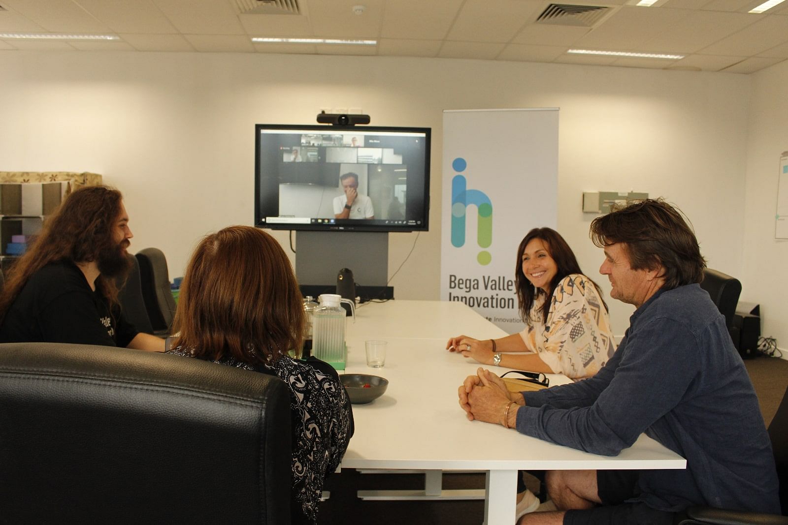 Small business owners participate in a videoconference training session.