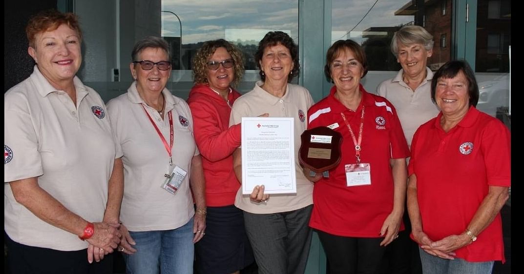 Volunteer women from Merimbula Red Cross standing together.