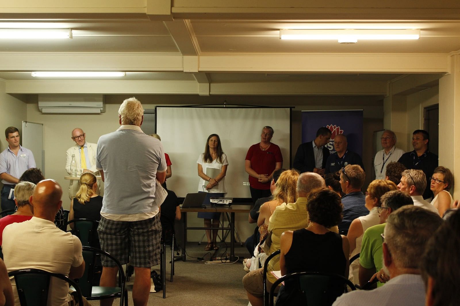 Local business owner questions NSW Government representatives at the Small Business Bushfire Assistance meeting in Bega.