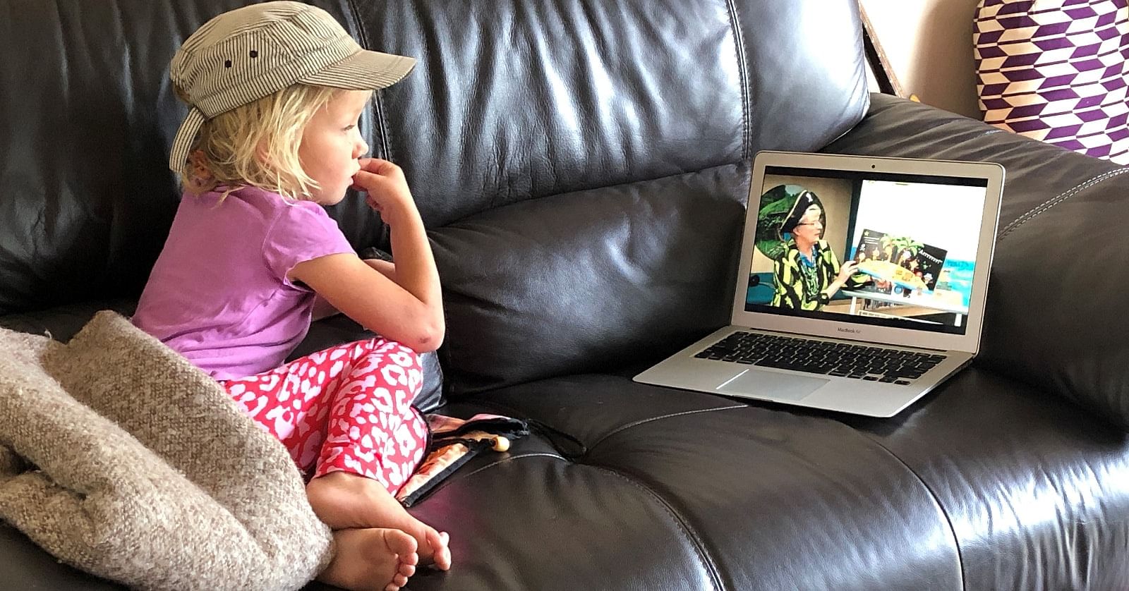 Young Lily watches Pirate Anne during a recent online Storytime.